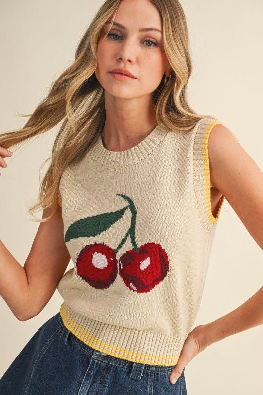 Chaleco tejido beige sin mangas con diseño de cerezas