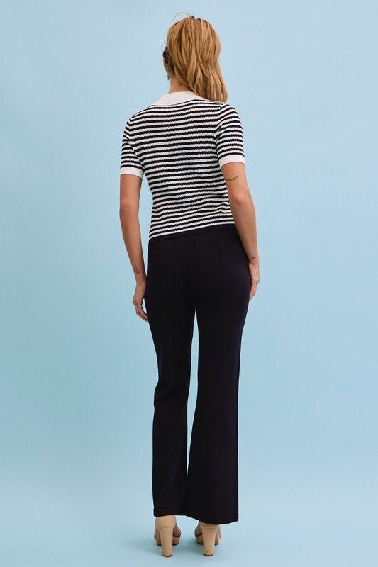 Set blusa rayas blanco y negro con pantalón palazzo negro